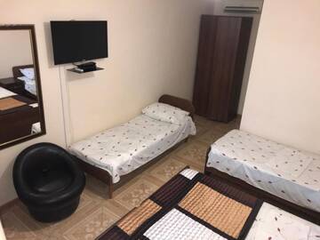 Фото номера Четырехместный номер с ванной комнатой Гостевой дом Guest House on Demerjipa г. Гагра 4