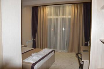Фото номера Улучшенный двухместный номер с 1 кроватью Гостевой дом Guest House on Ardzinba 91 г. Гагра 10