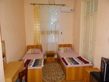 Фото номера Двухместный номер с 2 отдельными кроватями Гостевой дом Guest House Margarita г. Гагра 2