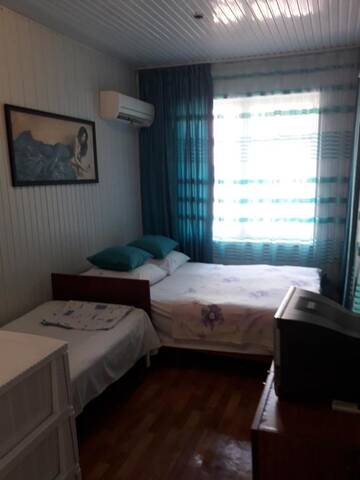 Фото номера Трехместный номер с общей ванной комнатой Гостевой дом Guest House Sakura г. Гагра 3