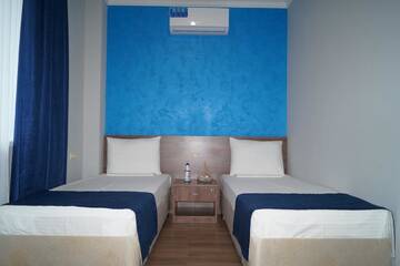 Фото номера Четырехместный номер с видом на горы Гостевой дом Nobi Guest House г. Гагра 6