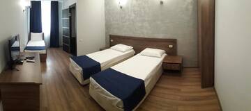 Фото номера Стандартный трехместный номер Гостевой дом Nobi Guest House г. Гагра 11