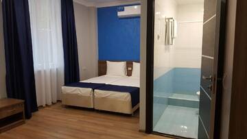 Фото номера Четырехместный номер с видом на горы Гостевой дом Nobi Guest House г. Гагра 15