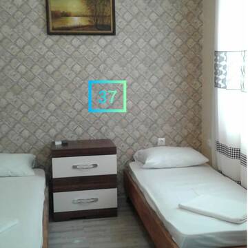 Фото номера Двухместный номер с 2 отдельными кроватями и видом на море Гостевой дом Guest House Polet Chayki г. Гагра 2