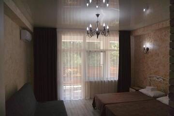 Фото номера Четырехместный номер &quot;Комфорт&quot; Мини-отель Gnezdo Beloy Sovy Mini Hotel г. Гагра 4