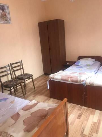 Фото номера Трехместный номер, вид на сад Гостевой дом Gortenziya г. Гагра 11
